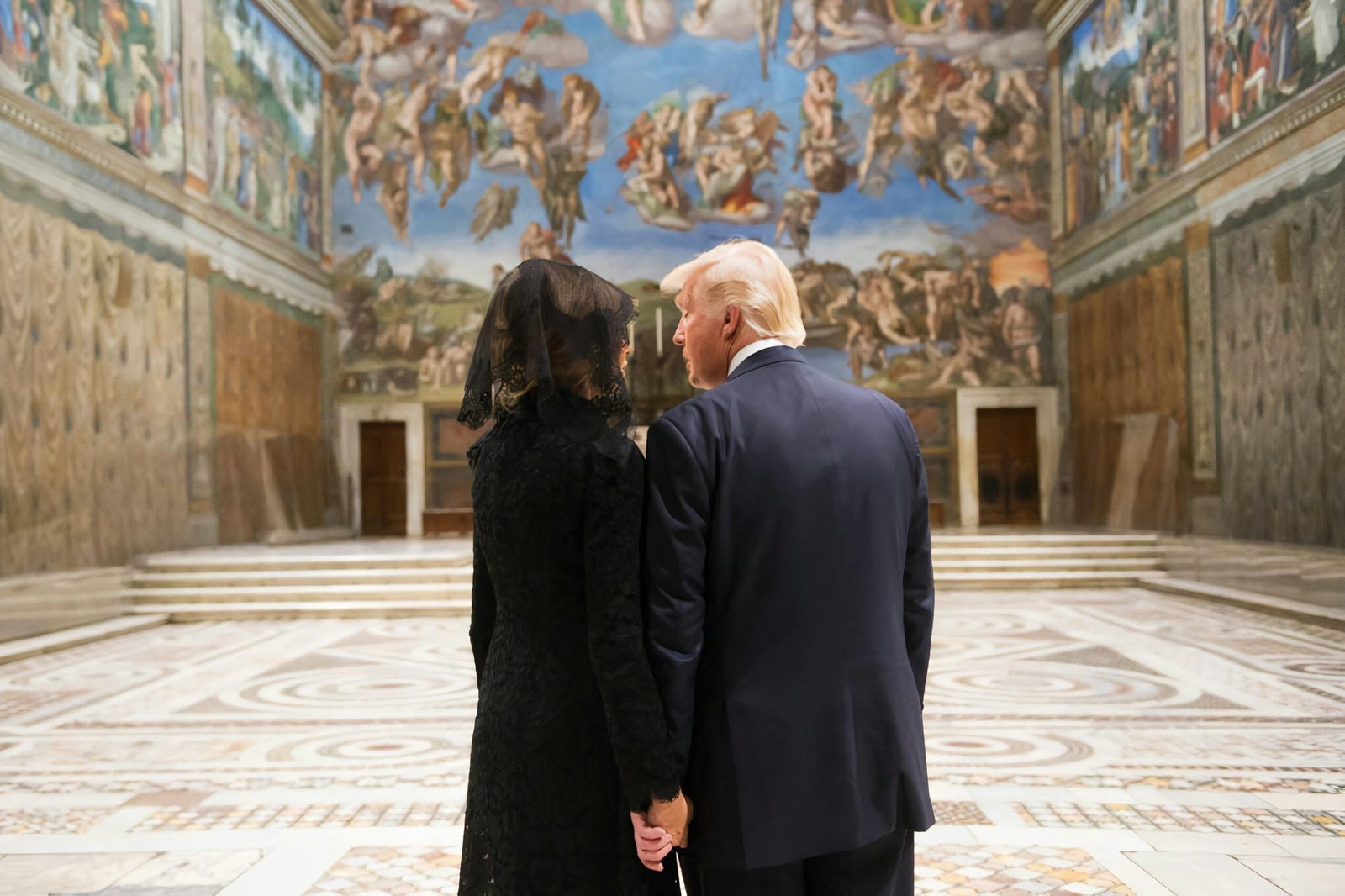 man in black suit standing beside woman in black dress